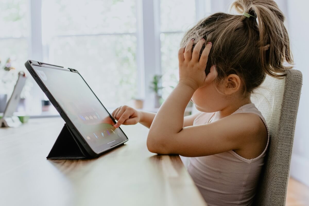 mall business owner using AI marketing tools on laptop with growth charts and customer engagement metrics displayed - AI in marketing for small businesses